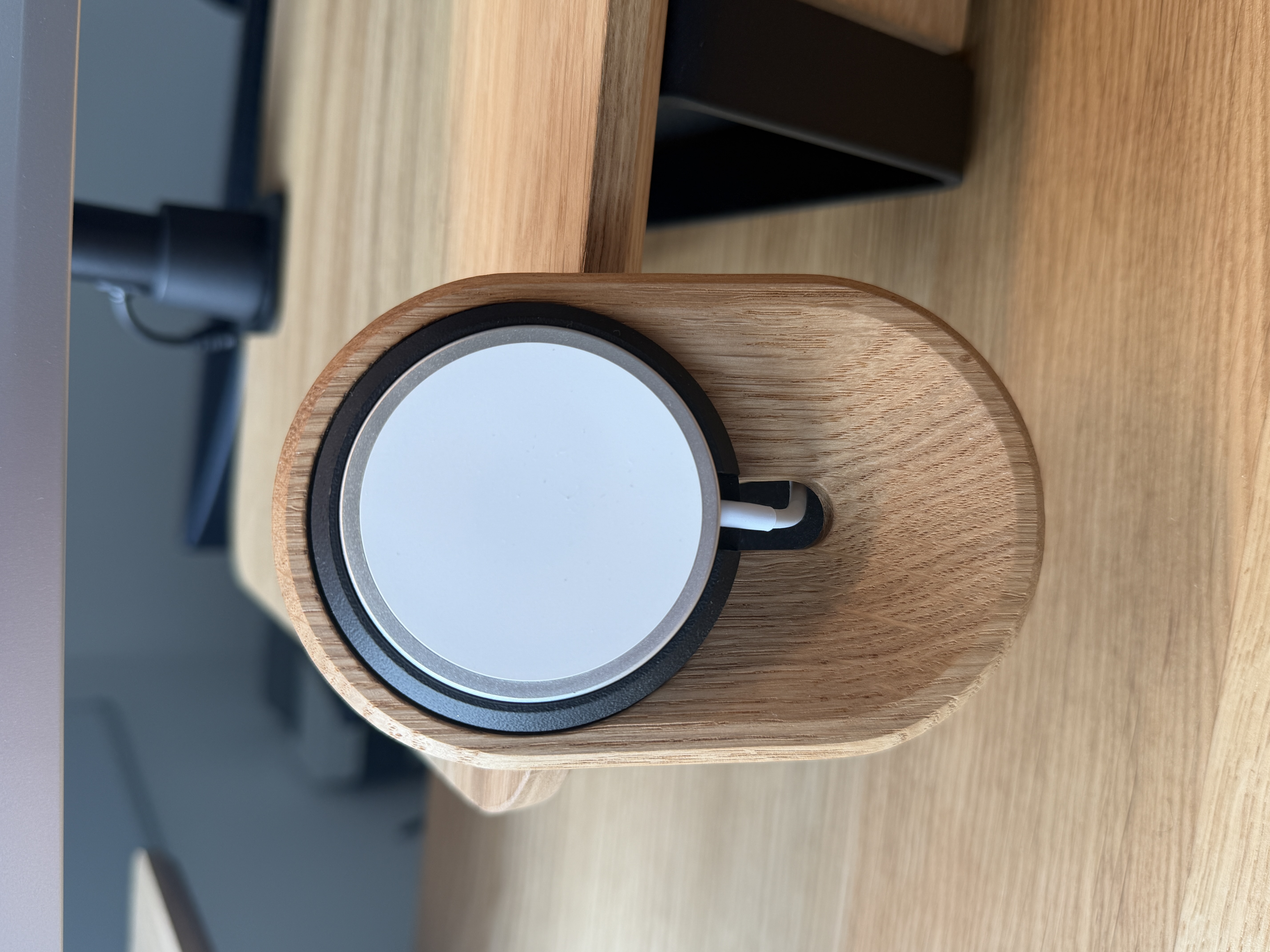 Felt tray and MagSafe puck on the wooden desk